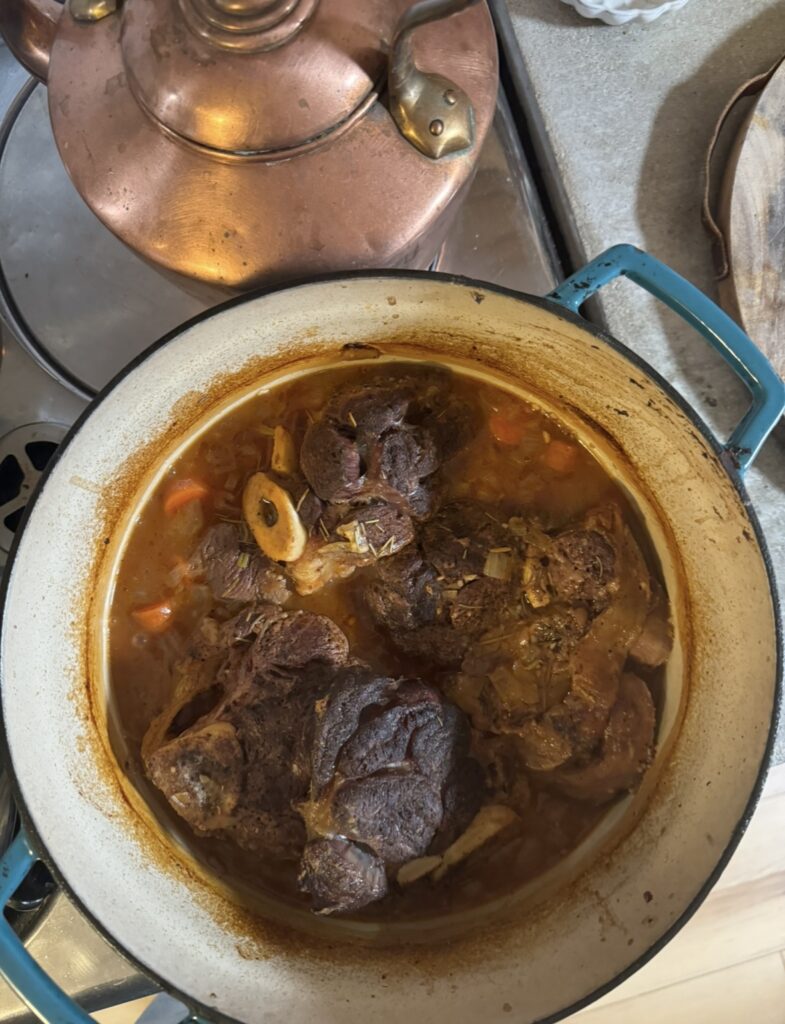 dutch oven with cooked beef shank inside