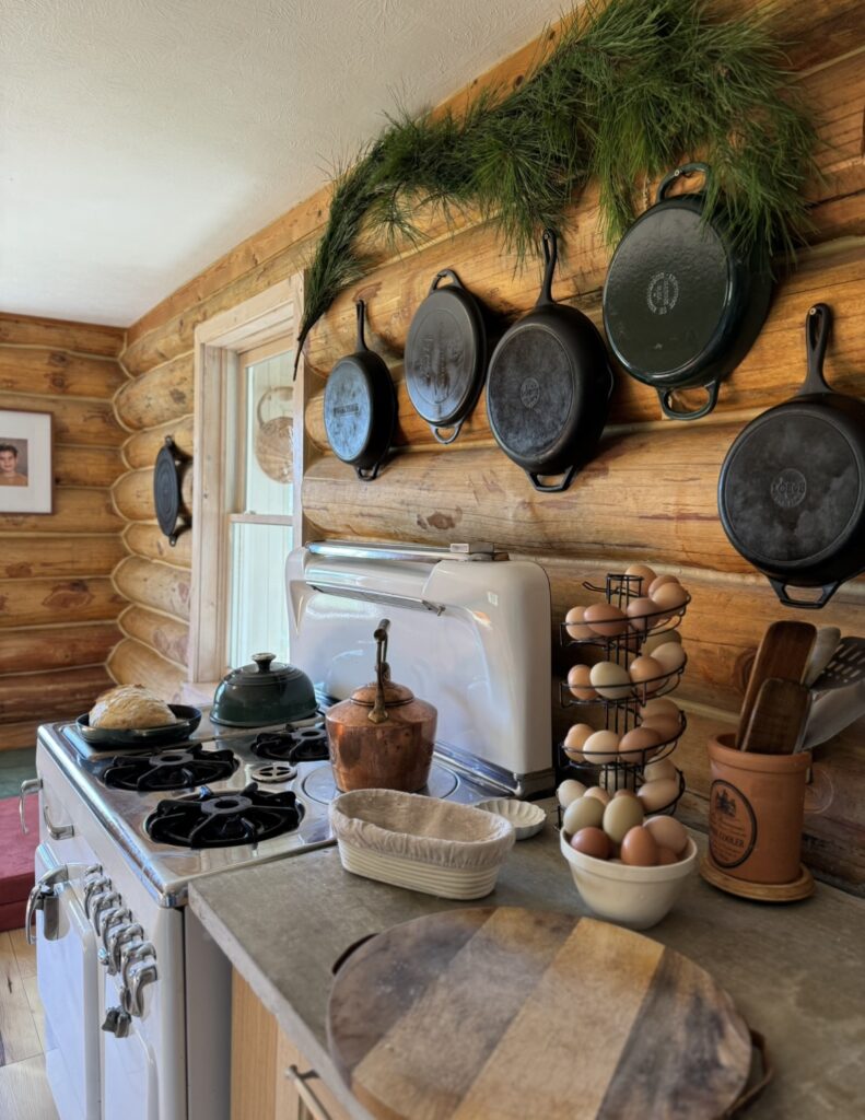 a wall of cast iron pans