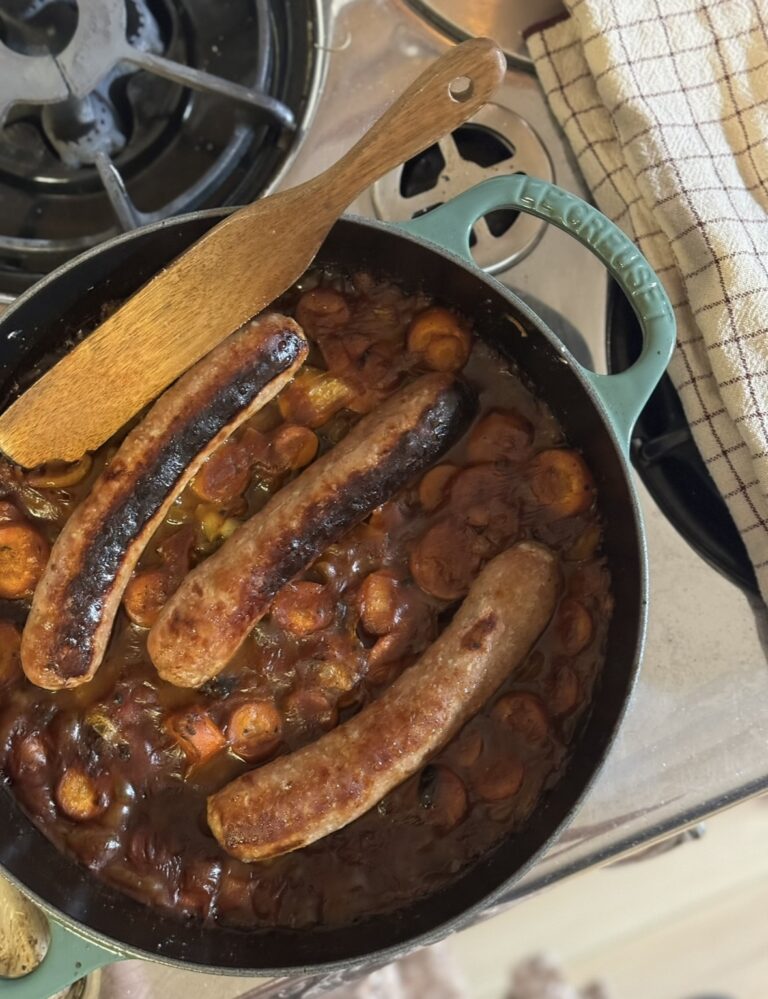 Le Creuset pan filled with sausage casserole